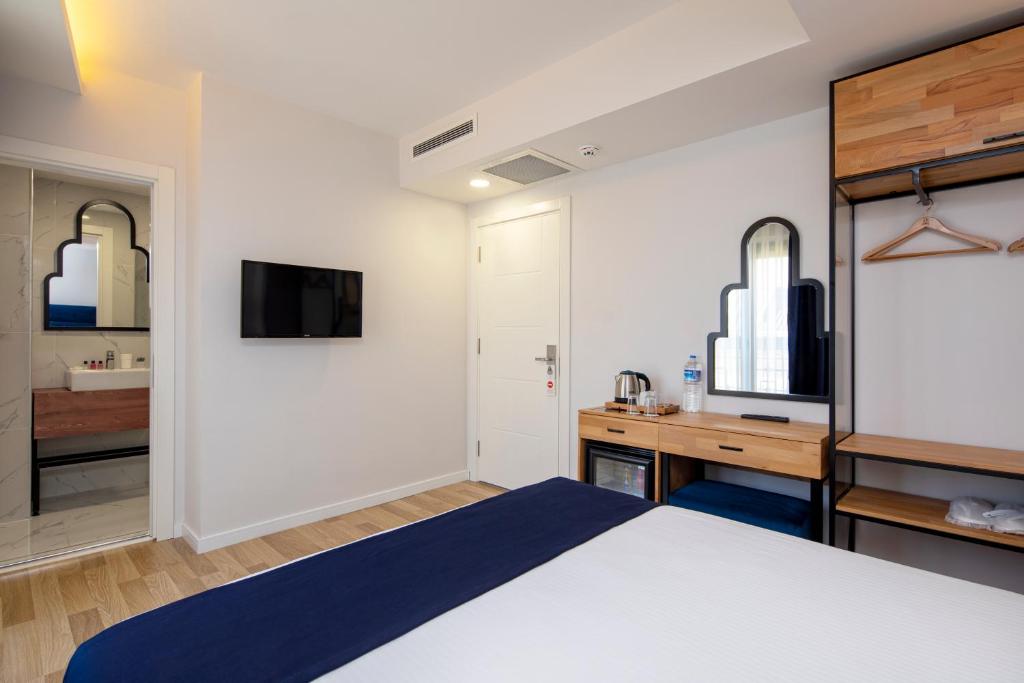 Postel nebo postele na pokoji v ubytování DORUK PALAS HOTEL