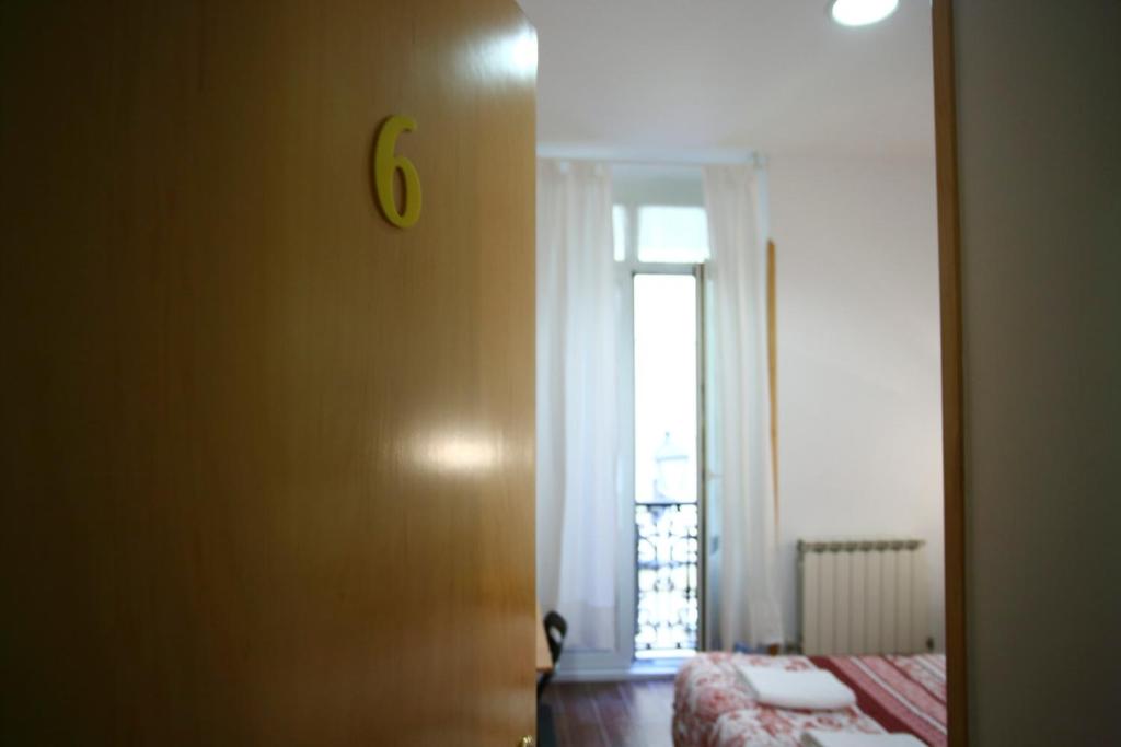 Postel nebo postele na pokoji v ubytování Pensión San Telmo / San Juan
