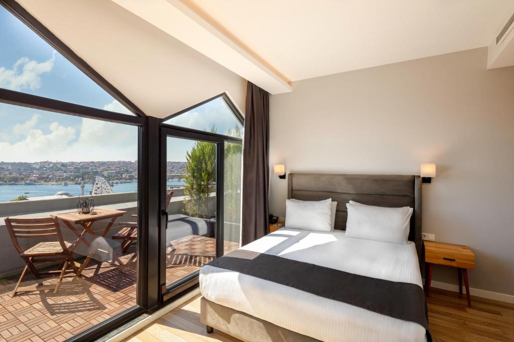 Postel nebo postele na pokoji v ubytování DORUK PALAS HOTEL