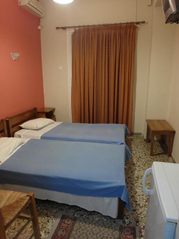 Voodi või voodid majutusasutuse Hotel Alexandrion toas