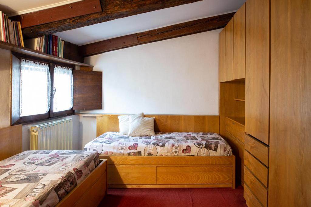 Posteľ alebo postele v izbe v ubytovaní Piazza San Marco - Cozy and warm apartment