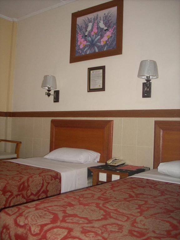 Postel nebo postele na pokoji v ubytování Hotel Sorga Cottages