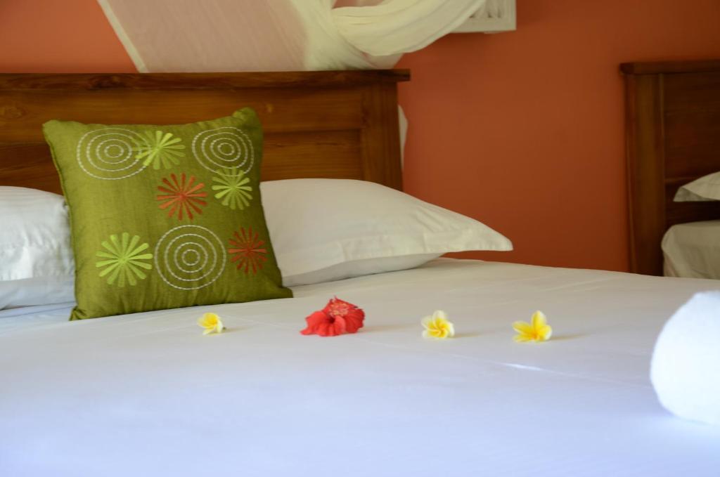 Postel nebo postele na pokoji v ubytování Arjuna Homestay