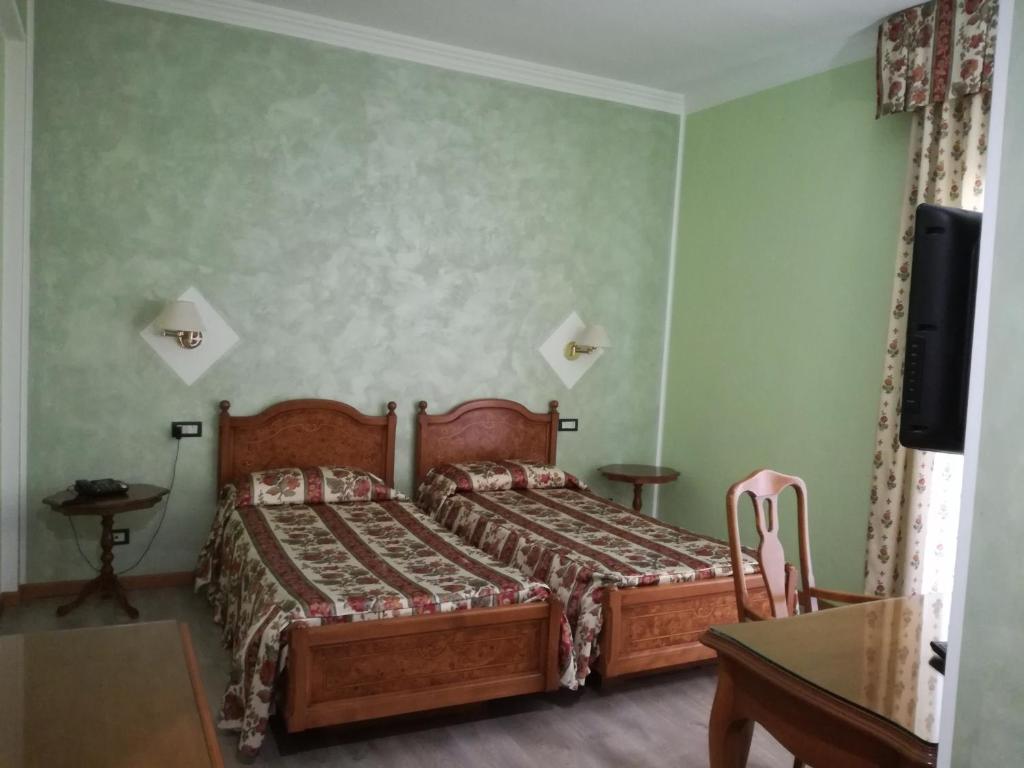 Postel nebo postele na pokoji v ubytování FILIPPONE HOTEL&RISTORANTE