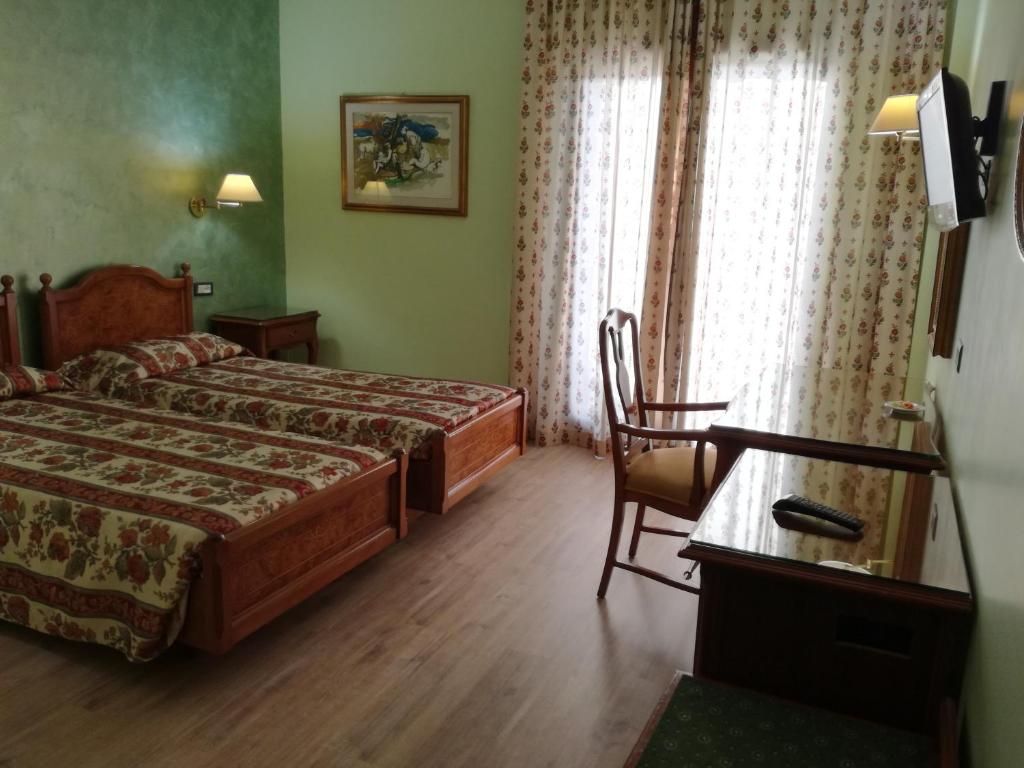 Postel nebo postele na pokoji v ubytování FILIPPONE HOTEL&RISTORANTE