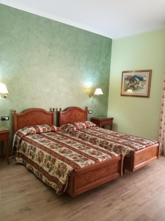Postel nebo postele na pokoji v ubytování FILIPPONE HOTEL&RISTORANTE