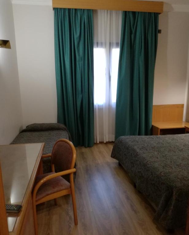 Postel nebo postele na pokoji v ubytování FILIPPONE HOTEL&RISTORANTE