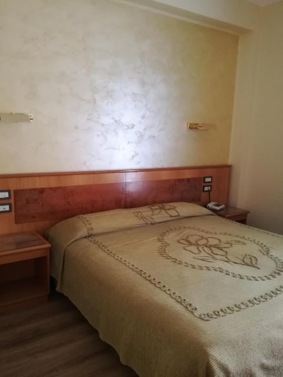 Postel nebo postele na pokoji v ubytování FILIPPONE HOTEL&RISTORANTE