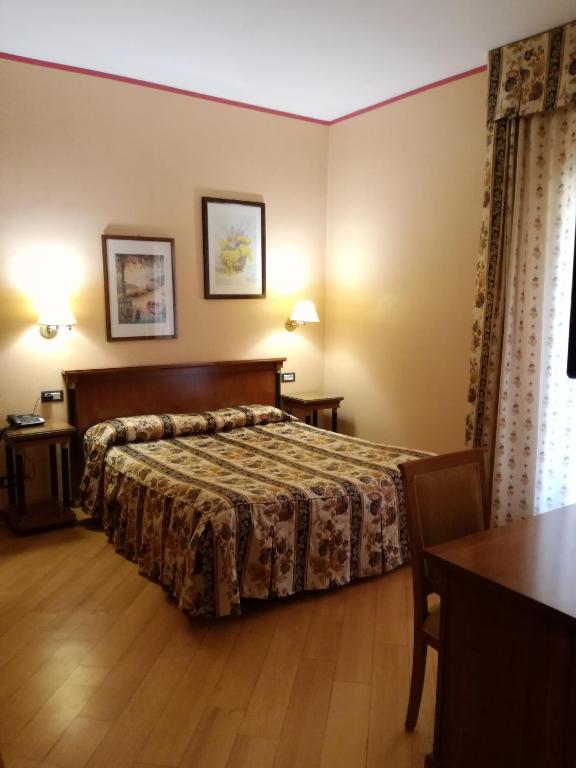 Postel nebo postele na pokoji v ubytování FILIPPONE HOTEL&RISTORANTE