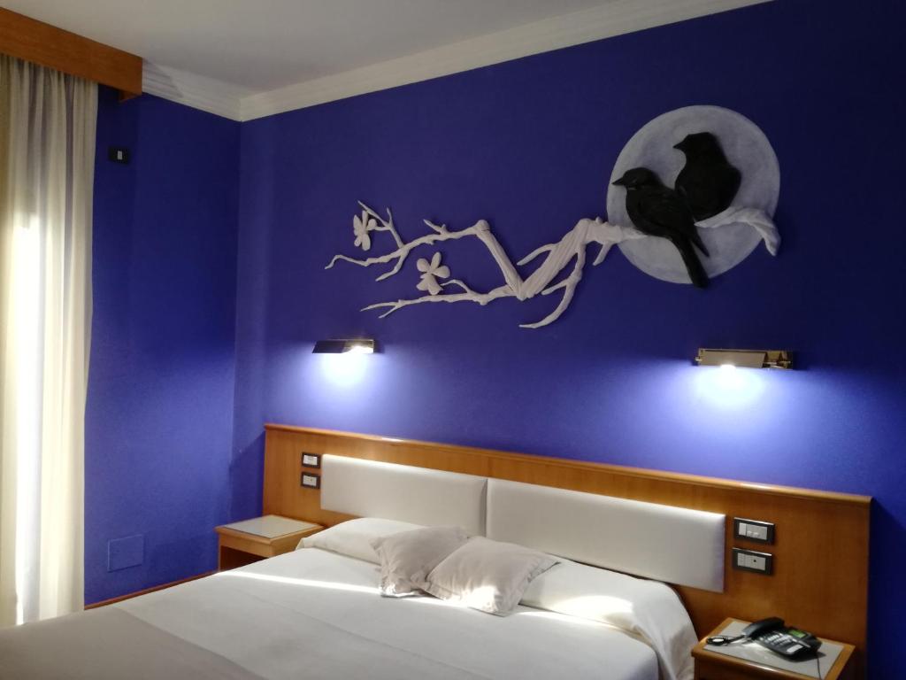 Postel nebo postele na pokoji v ubytování FILIPPONE HOTEL&RISTORANTE