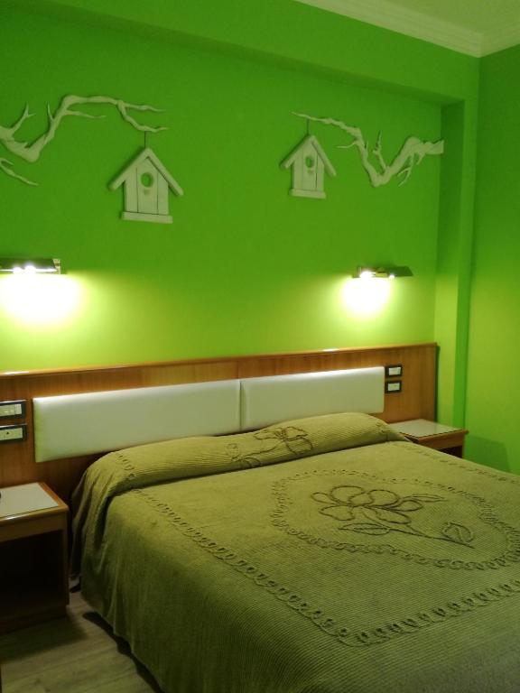 Postel nebo postele na pokoji v ubytování FILIPPONE HOTEL&RISTORANTE