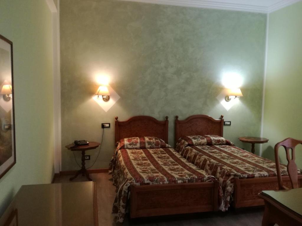 Postel nebo postele na pokoji v ubytování FILIPPONE HOTEL&RISTORANTE