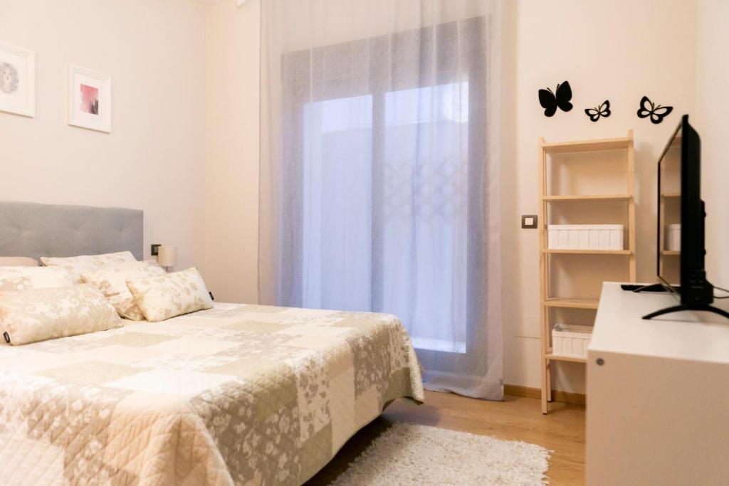 Łóżko lub łóżka w pokoju w obiekcie Apartamento Málaga Litoral Beach