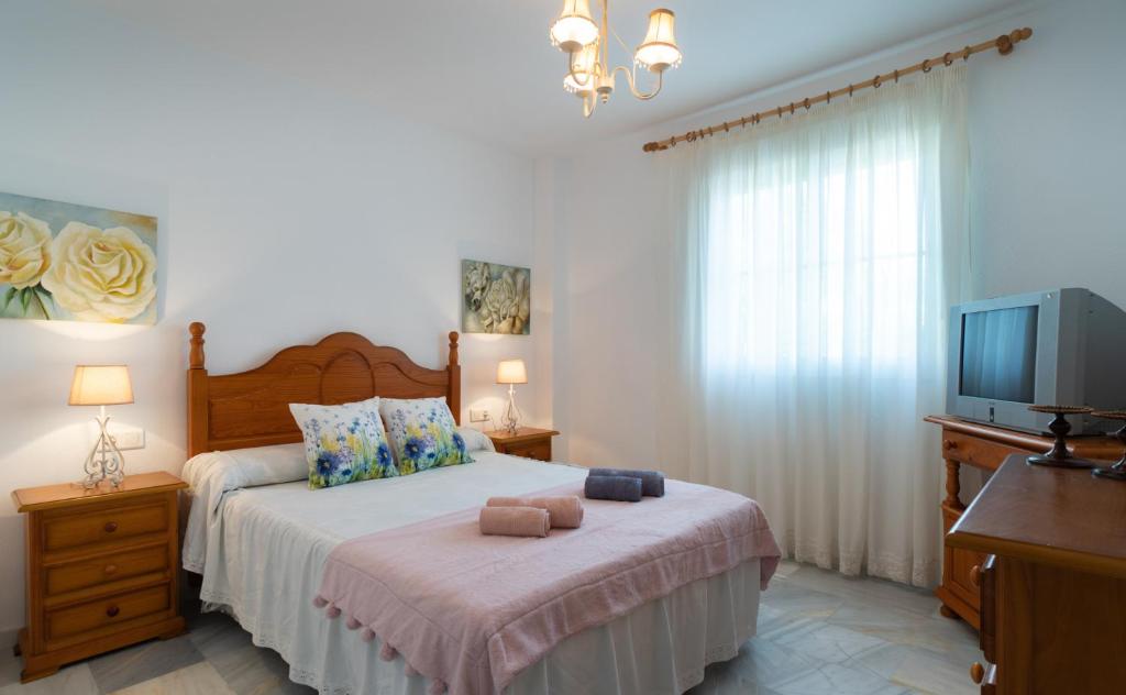 Postel nebo postele na pokoji v ubytování Holidays & Homes I Benalmádena Playa, piscinas ,relax