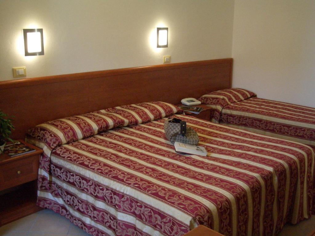 Postel nebo postele na pokoji v ubytování Hotel Bristol - Koolibry Hotels