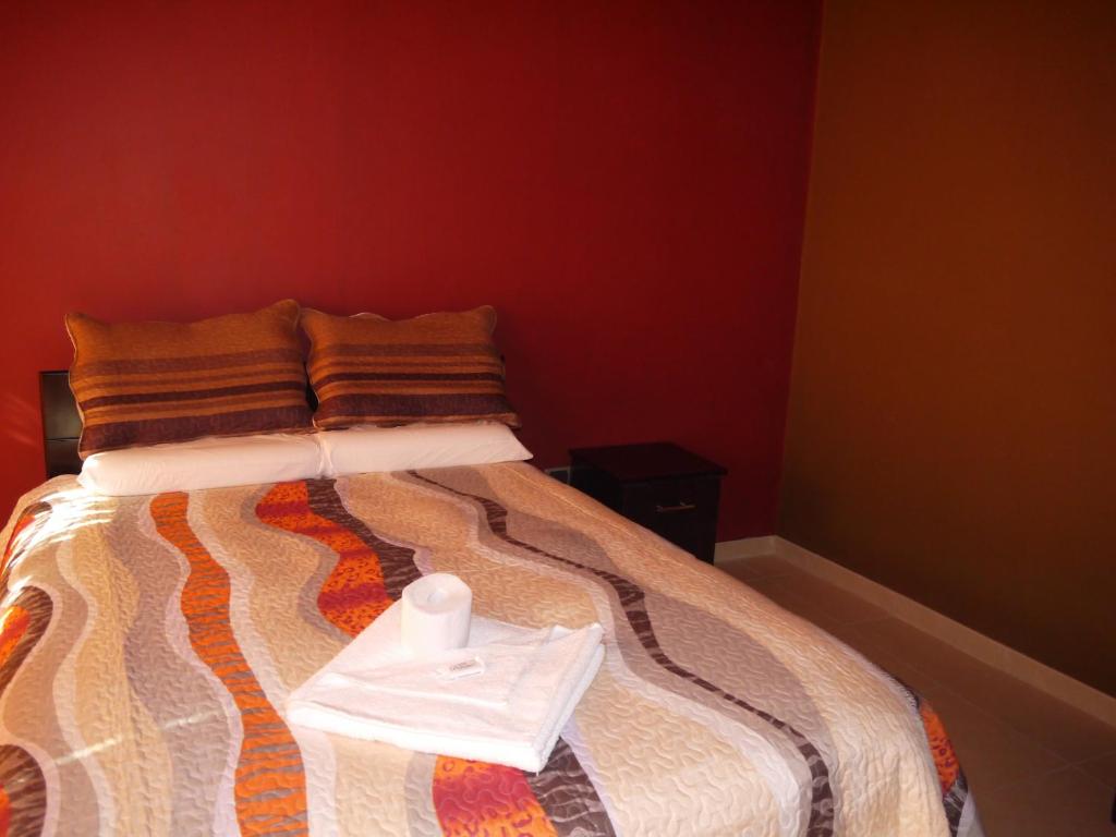 Postel nebo postele na pokoji v ubytování Hotel Suite Juliaca