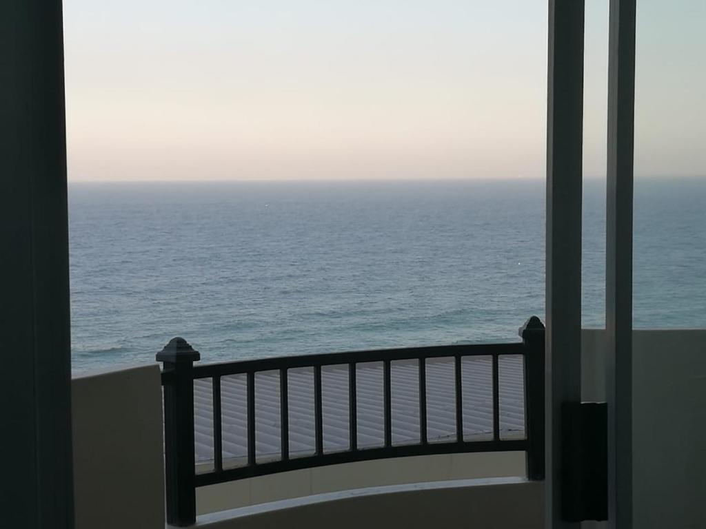 a view of the ocean from a balcony at Beachfront - 34 Blue Largo in Westbrook