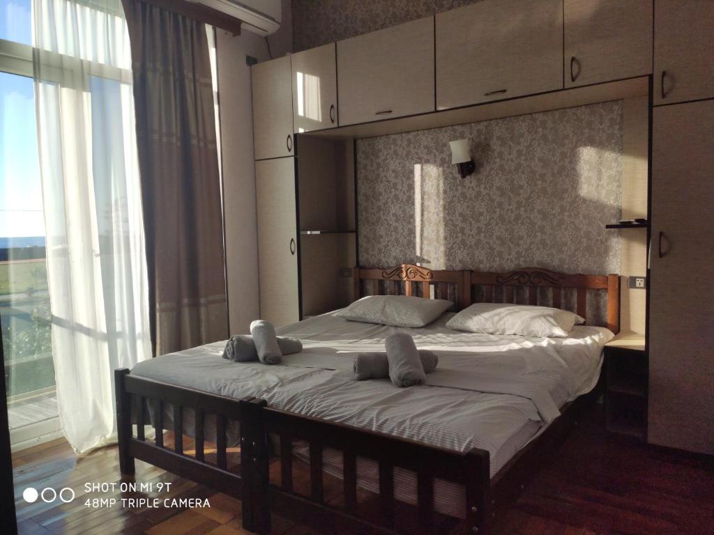 Postel nebo postele na pokoji v ubytování Tirkius House