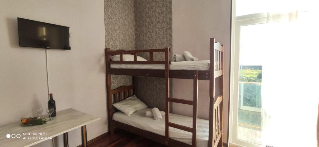 Postel nebo postele na pokoji v ubytování Tirkius House
