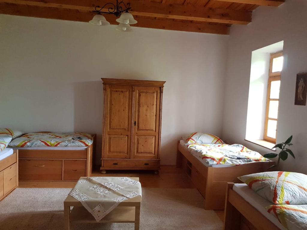 A bed or beds in a room at Garábi Udvarház