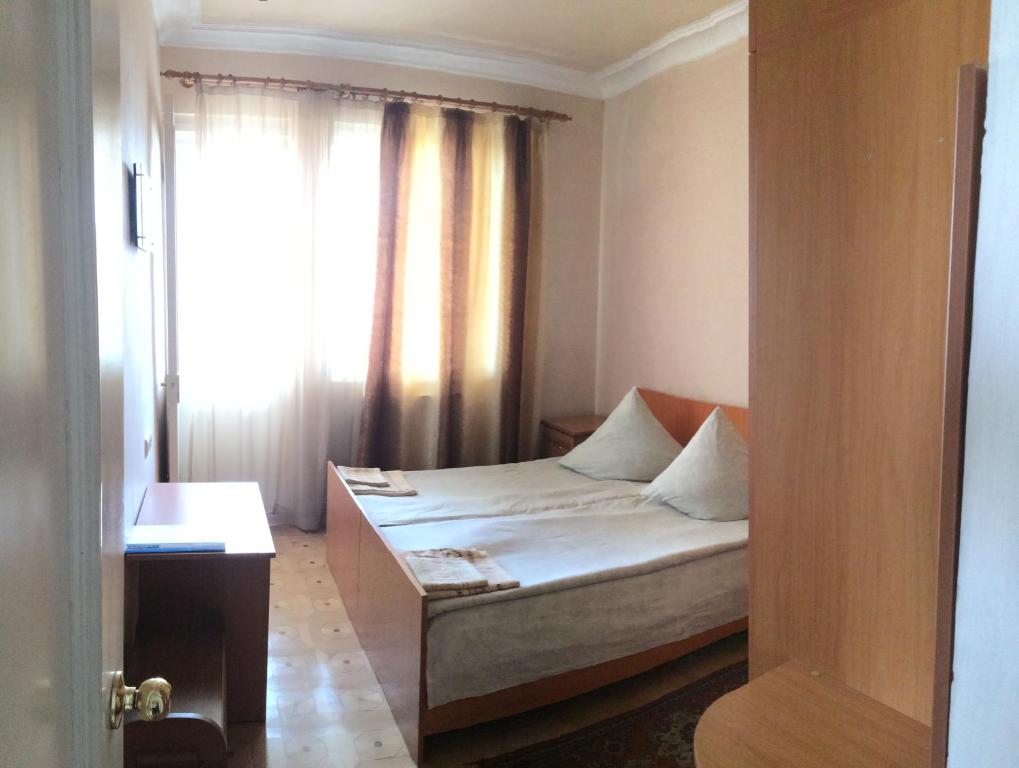 Postel nebo postele na pokoji v ubytování Guest House Lilia