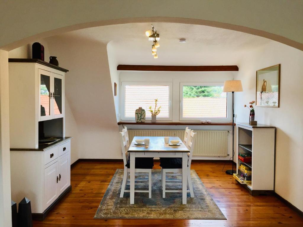 a kitchen with a table and chairs in a room at Ferienwohnung Molter in Oberthal