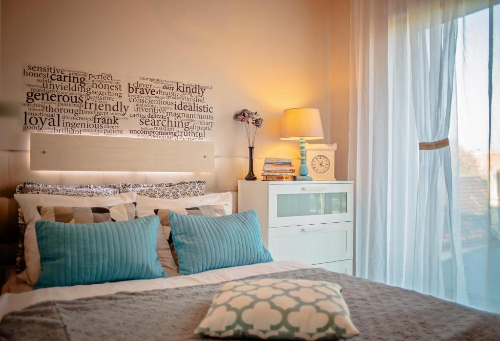 Postel nebo postele na pokoji v ubytování Apartamenty Homely Place Casa Verona - Stary Rynek - Parking