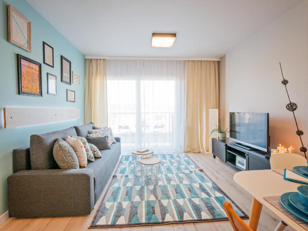 TV a/nebo společenská místnost v ubytování Apartamenty Homely Place Casa Verona - Stary Rynek - Parking