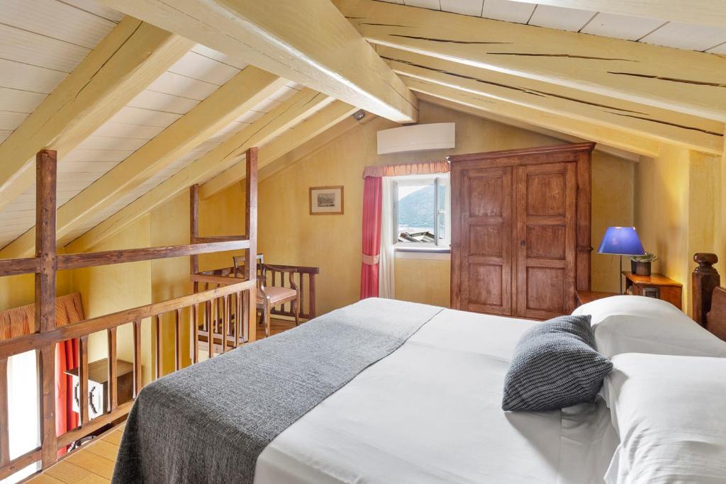 Postel nebo postele na pokoji v ubytování Hotel Pironi