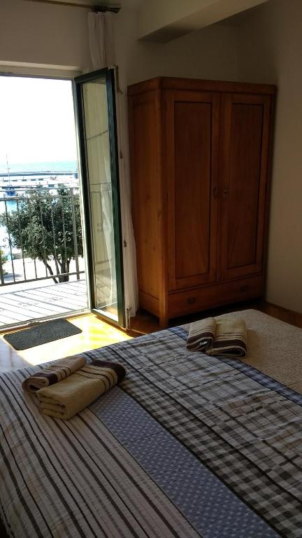 Postel nebo postele na pokoji v ubytování Apartments Monika