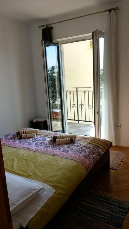 Postel nebo postele na pokoji v ubytování Apartments Monika