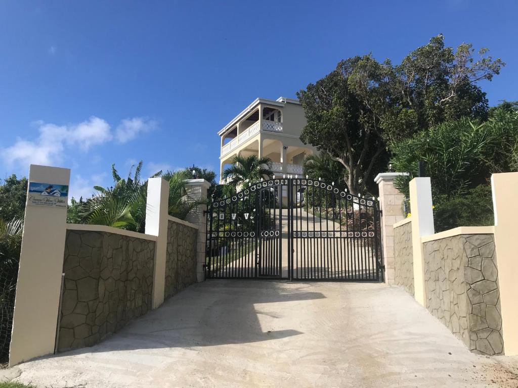 a gate in front of a house at Ocean View Villas in Jost Van Dyke