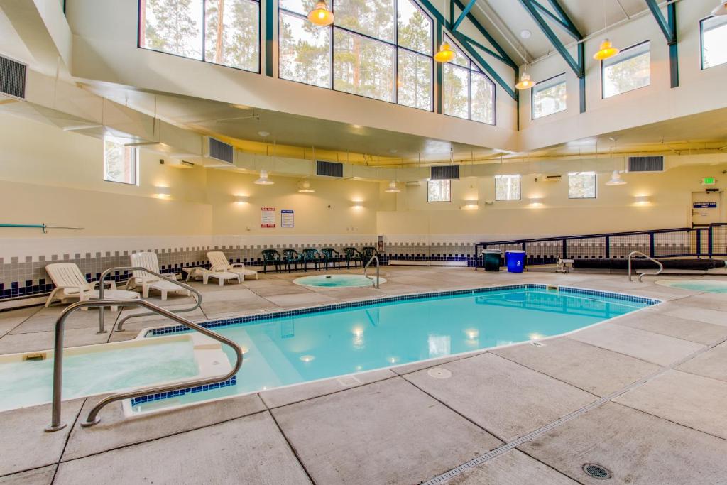 a large indoor pool in a building with a large ceiling at Lodgepole Condos in Silverthorne