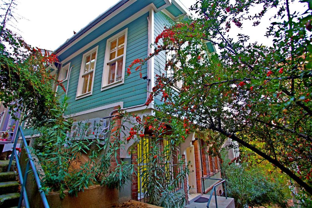 a house that has a tree in front of it at Dreamers V&V Hotel Cihangir in Istanbul