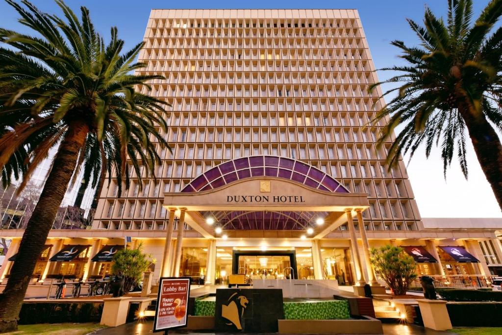a large building with a large clock on the front of it at Duxton Hotel Perth in Perth