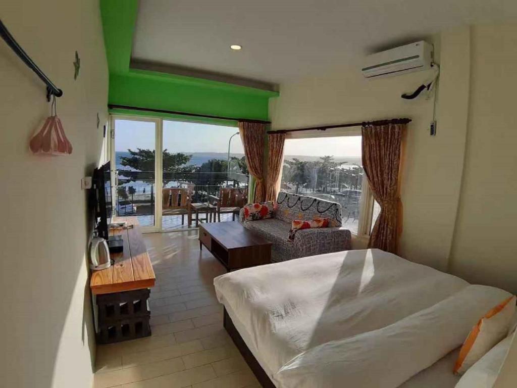 Postel nebo postele na pokoji v ubytování Hearty Homestay