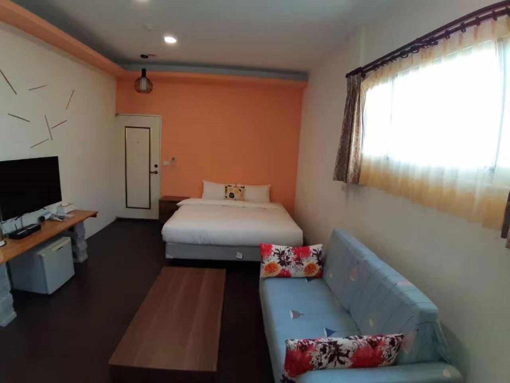 Postel nebo postele na pokoji v ubytování Hearty Homestay