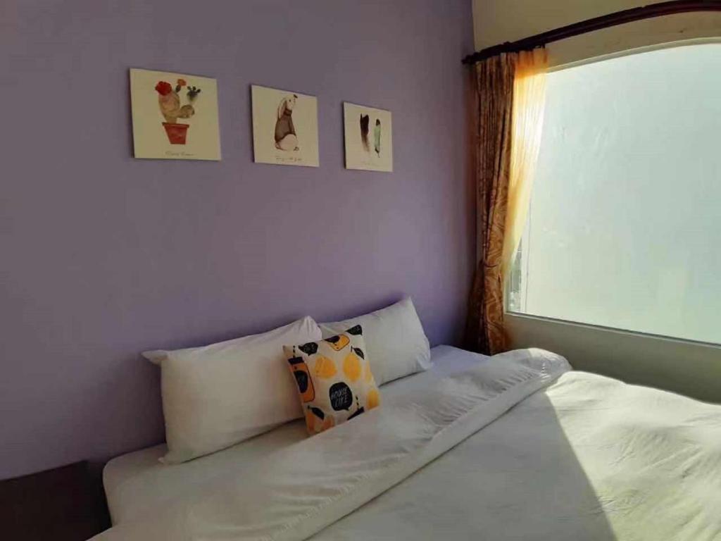 Postel nebo postele na pokoji v ubytování Hearty Homestay