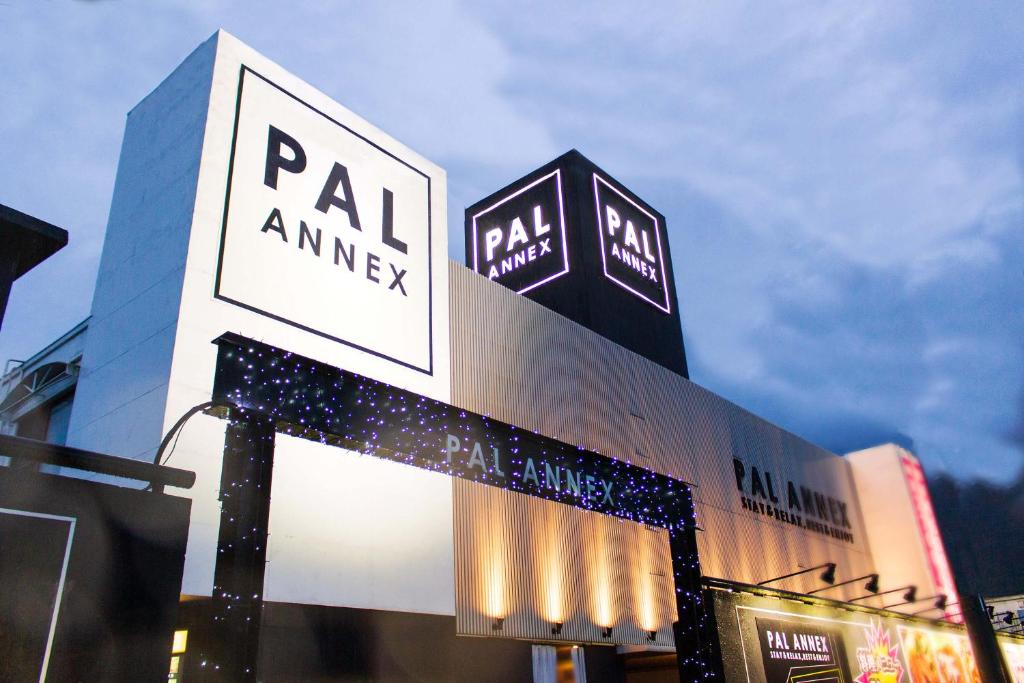 a building with a sign on the side of it at Pal Annex Katsuyama (Love Hotel) in Miyakomachi