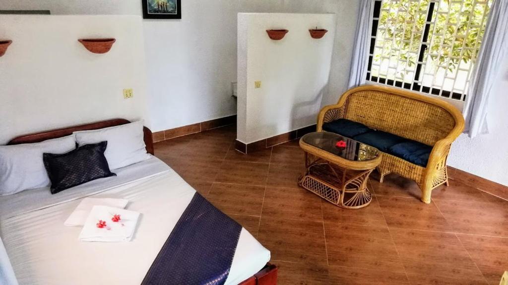 Postel nebo postele na pokoji v ubytování Q Bungalows