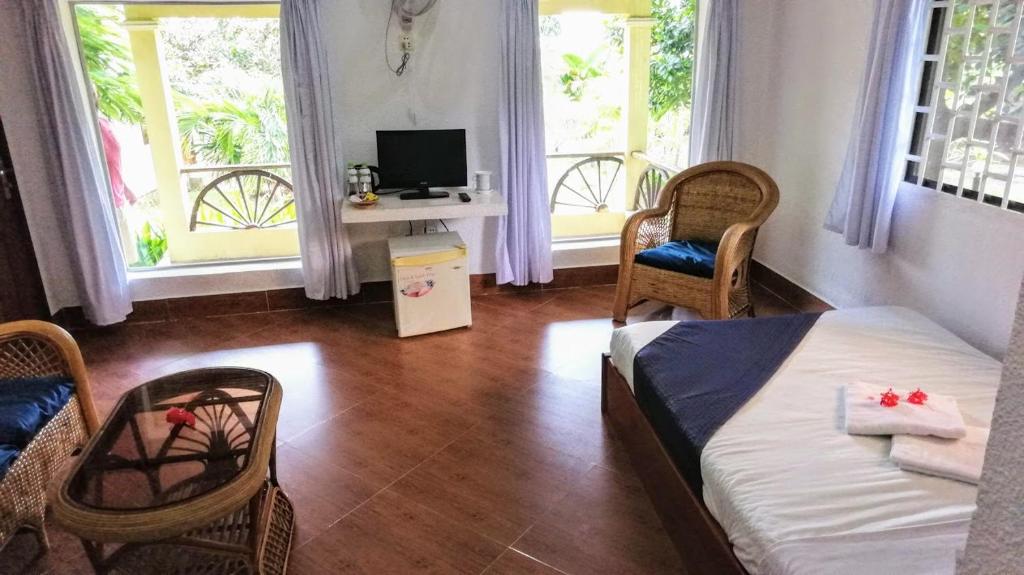 Postel nebo postele na pokoji v ubytování Q Bungalows