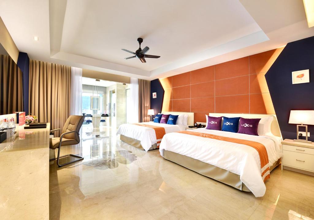 Postel nebo postele na pokoji v ubytování Lexis Suites Penang