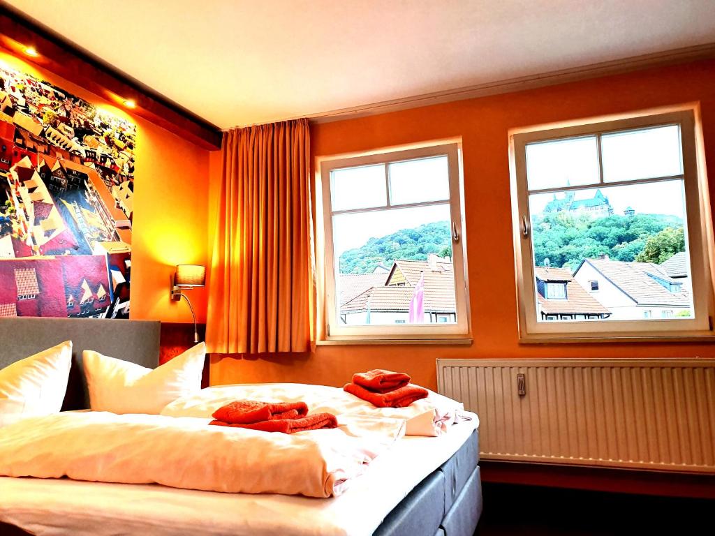 Postel nebo postele na pokoji v ubytování Apart Hotel Wernigerode