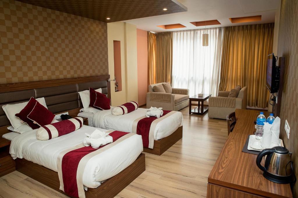 Letto o letti in una camera di The Address Kathmandu Hotel