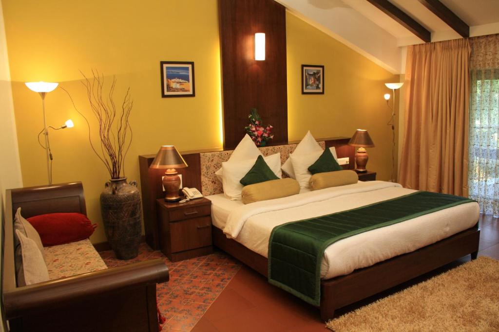 Postel nebo postele na pokoji v ubytování Tangerine Boutique Resort