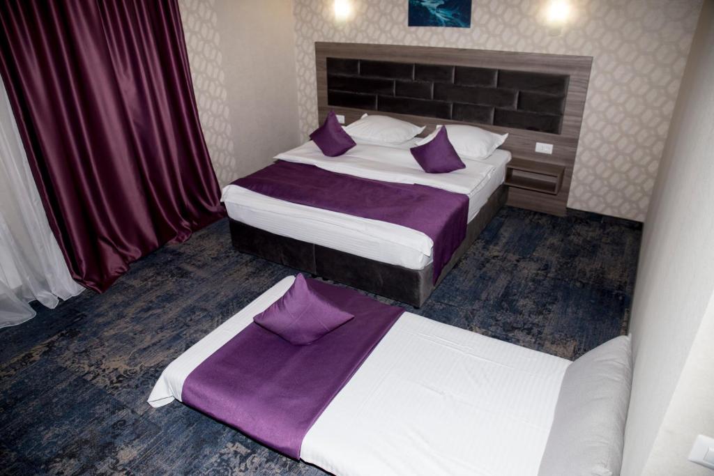 Postel nebo postele na pokoji v ubytování Hotel Yarus Plus