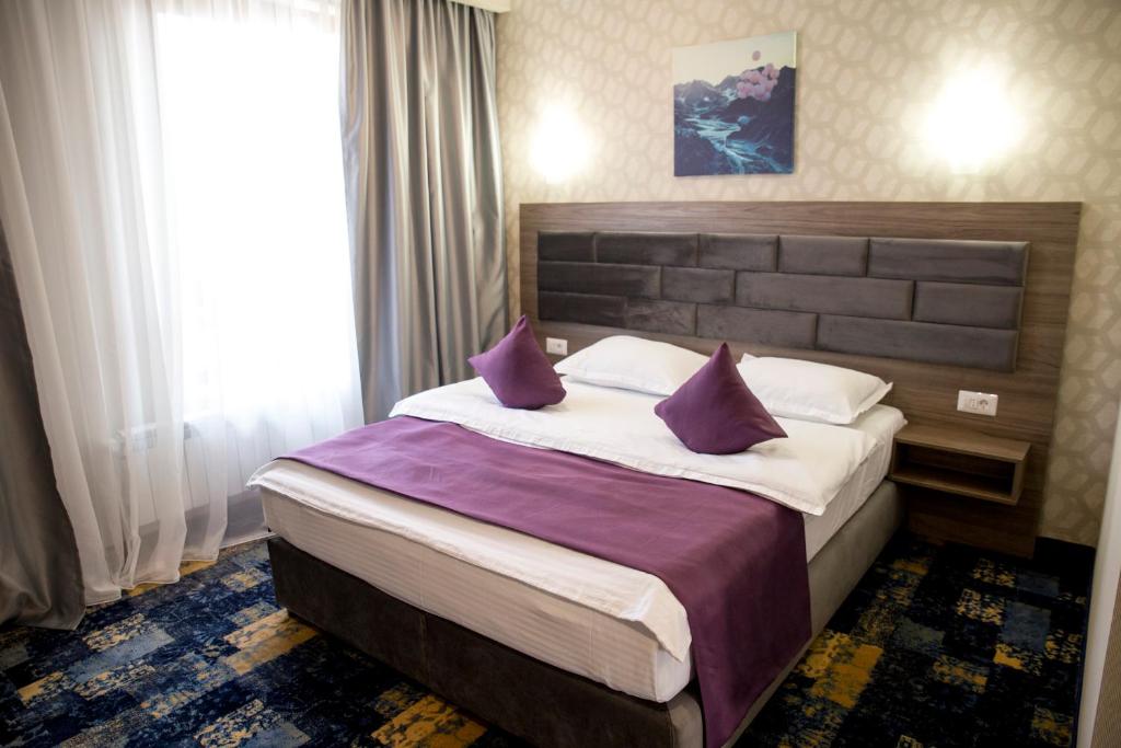Postel nebo postele na pokoji v ubytování Hotel Yarus Plus