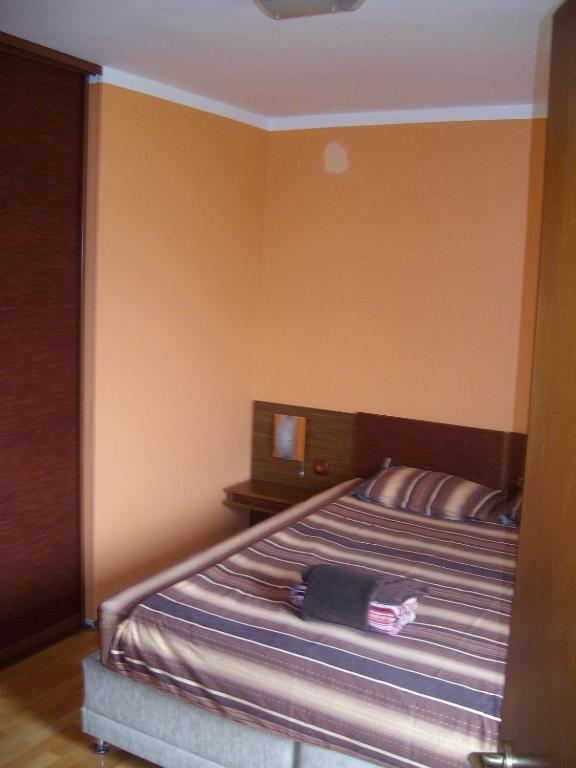 A bed or beds in a room at Bulhotel Pritzker Apartment