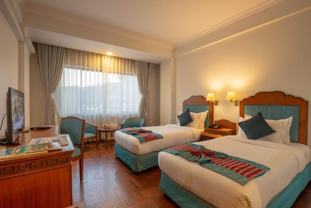 Postel nebo postele na pokoji v ubytování Hotel Le Himalaya