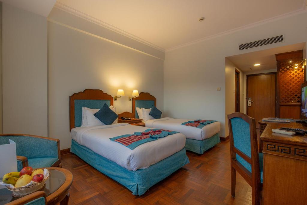 Postel nebo postele na pokoji v ubytování Hotel Le Himalaya